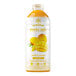 A plastic bottle of Smartfruit Mellow Mango puree with yellow and white label.