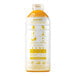 A white plastic bottle of Smartfruit Mellow Mango puree with yellow text and orange liquid inside.