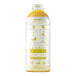 A white plastic bottle of Smartfruit Sunny Banana Puree with yellow text and a yellow liquid.