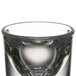 A close up of a clear Libbey tall shot glass.