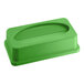 A lime green rectangular plastic lid with an oval hole.