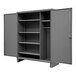 A grey metal Durham wardrobe cabinet with shelves inside.