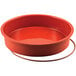 A red round Silikomart silicone baking mold.