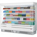 A white Turbo Air vertical air curtain display case filled with drinks.