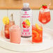 A white tray with three Smartfruit Lemon Blush drinks on a table.