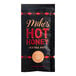 A black Mike's Hot Honey Extra Hot packet with red text.