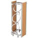A wooden and metal rack with three rings holding metal cylinders.