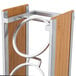 A metal and wood stand with three circular rings.
