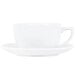 A CAC bright white Clinton cappuccino cup and saucer on a white surface.