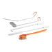 A white and orange Fryclone deep fryer cleaning kit with brushes, a clean out rod, and a crumb scoop.