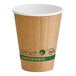 A brown compostable double wall paper hot cup with green labeling and a white interior.