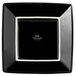 A Tuxton Concentrix black square china plate with white trim.