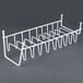 A white metal wire rack with 8 spirals.
