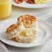 A Pillsbury golden buttermilk biscuit on a plate.