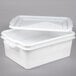 A white plastic Vollrath perforated drain box with a lid.