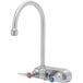 A silver Eversteel wall mount faucet with two knobs.