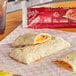 A Hot Pockets ham and cheese burrito on a paper towel.