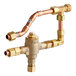 A Stiebel Eltron mixing valve kit with copper pipes connected to fittings.