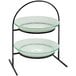 A Rosseto Kalderon Radici 2 Level Round Display Stand with 14" Round White Glass Bowls holding white glass bowls on a stand.