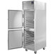 A silver Delfield reach-in refrigerator with a half door open.