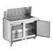 A stainless steel commercial refrigerator with two open doors.