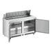 An Avantco stainless steel refrigerated sandwich prep table with two open doors.