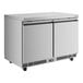 A stainless steel, two-door undercounter refrigerator with a digital temperature display.