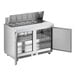 An Avantco stainless steel refrigerated sandwich prep table with two open doors.