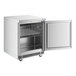 A stainless steel undercounter freezer with a single open door and an interior wire shelf.