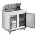 An Avantco stainless steel refrigerated sandwich prep table with two doors open.