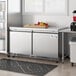 An Avantco stainless steel undercounter freezer with a door on a counter.