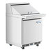 An Avantco stainless steel refrigerated sandwich prep table with an open door.