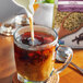 Pacific Foods Unsweetened Vanilla Hemp Milk being poured into a glass cup.