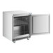 A stainless steel undercounter refrigerator with a single open door and an interior wire shelf.