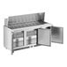 An Avantco refrigerated sandwich prep table with open doors on a stainless steel counter.