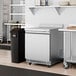 An Avantco stainless steel worktop freezer with a black surface.
