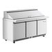 A stainless steel Avantco refrigerated sandwich prep table with three doors.