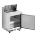 An Avantco stainless steel refrigerated sandwich prep table with the door open.