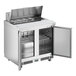 An Avantco stainless steel refrigerator with two doors open.