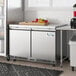 An Avantco white stainless steel undercounter freezer with a freezer door.