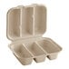 A white World Centric compostable fiber taco clamshell with three compartments.