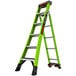 A green Little Giant King Kombo industrial ladder with black wheels.