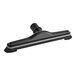 A black Lavex carpet tool with bristle ends and a black handle.