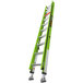 A green Little Giant fiberglass extension ladder with silver legs.