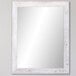 A white rectangular BrandtWorks mirror with a wooden frame on a wall.