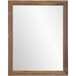 A BrandtWorks natural wood tone mirror with a wooden frame.