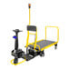 A black and yellow Amigo Dex Pro+ motorized carrier with a handle.