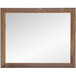 A BrandtWorks rectangular mirror with a wooden frame.