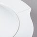 A close up of a white porcelain pasta serving bowl with a lid.