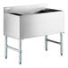 A Steelton stainless steel underbar ice bin with bottle holders.